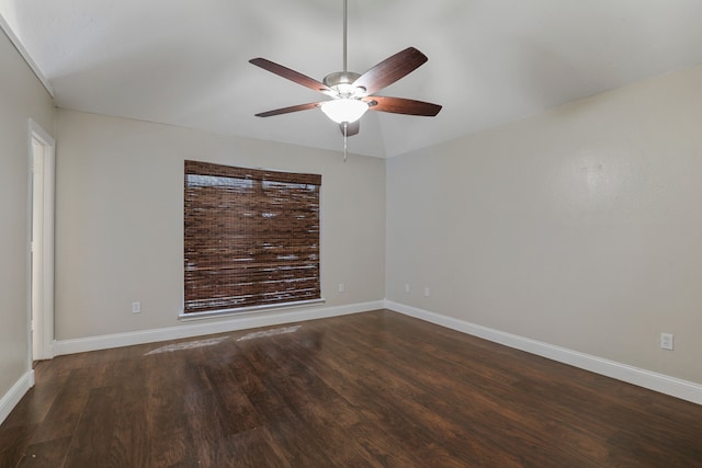 spare room featuring ceiling fan and dark hardwood / wood-style floors