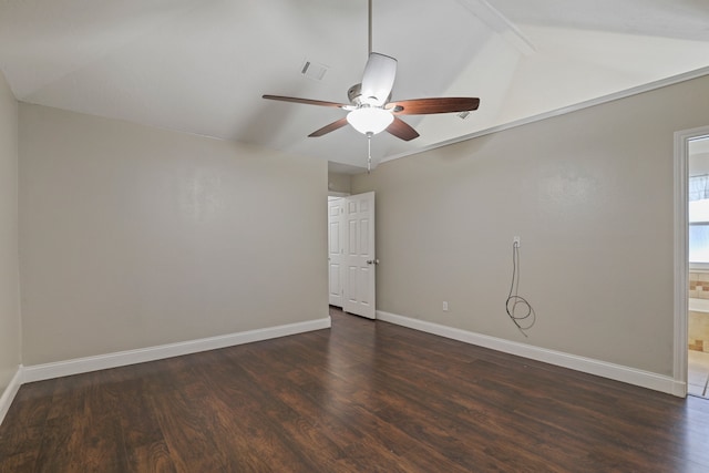 empty room featuring lofted ceiling with beams, dark hardwood / wood-style flooring, and ceiling fan