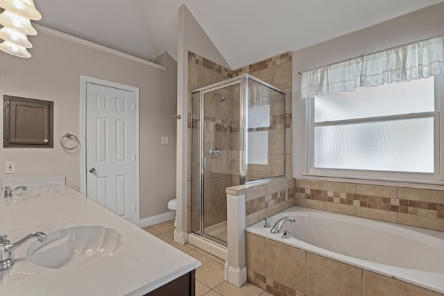 full bathroom with lofted ceiling, toilet, tile patterned floors, vanity, and independent shower and bath