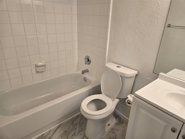 full bathroom with vanity, toilet, and tiled shower / bath