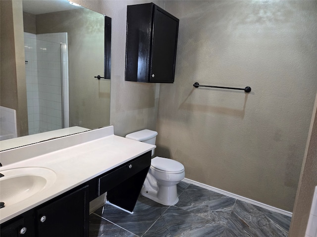 bathroom with vanity, toilet, and an enclosed shower