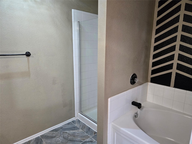 bathroom featuring plus walk in shower