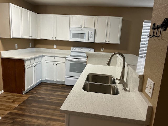 kitchen featuring sink, light stone countertops, white appliances, white cabinets, and dark wood-type flooring