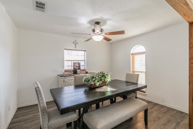 dining room featuring dark hardwood / wood-style flooring, ceiling fan, and plenty of natural light