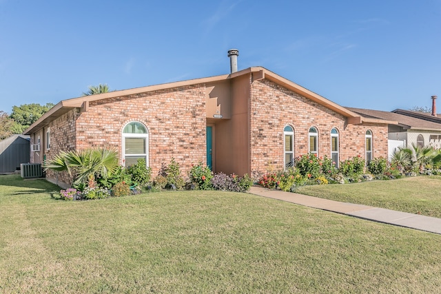 view of front of home featuring a front yard and cooling unit