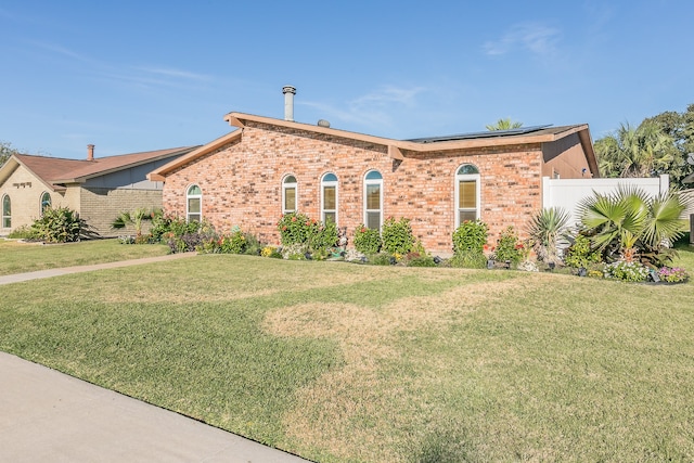 ranch-style house with a front yard