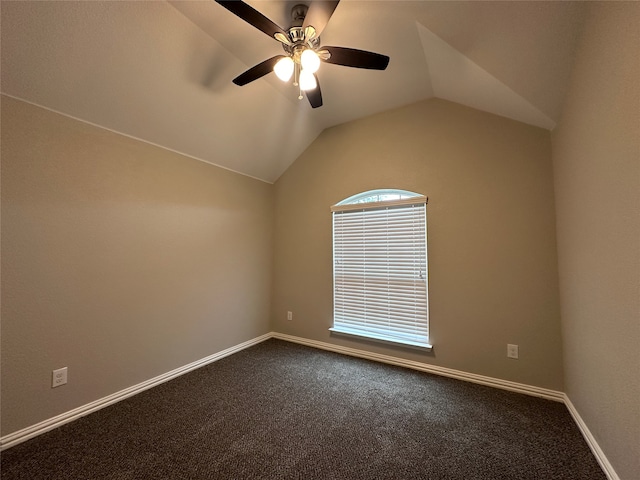 carpeted spare room featuring ceiling fan and lofted ceiling