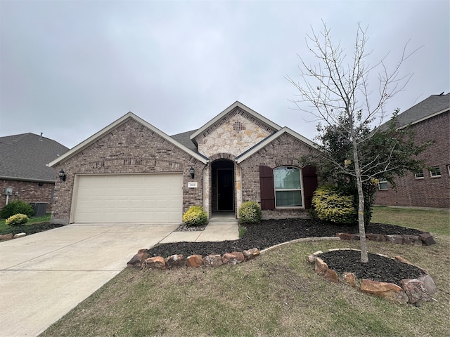 ranch-style house featuring a front lawn and a garage