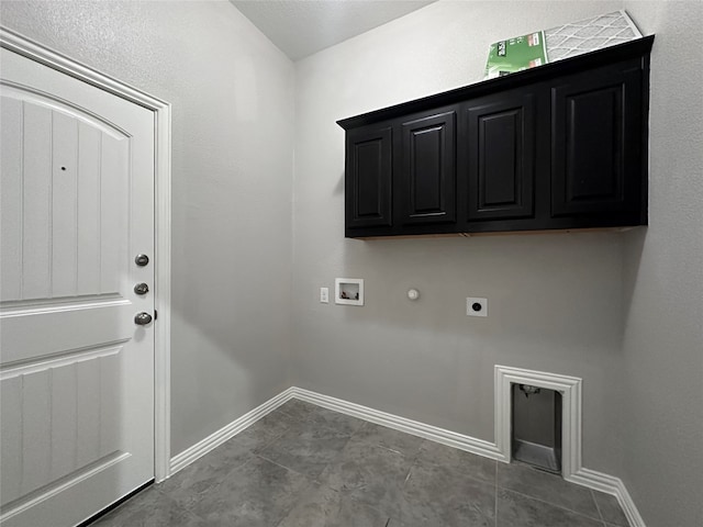 laundry area featuring cabinets, tile patterned flooring, electric dryer hookup, gas dryer hookup, and hookup for a washing machine