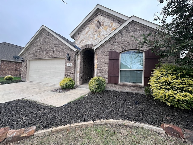 view of front of home with a garage