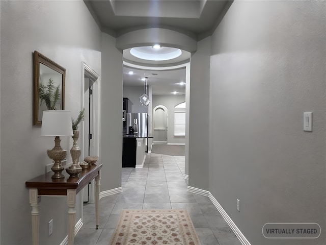 corridor with light tile patterned flooring