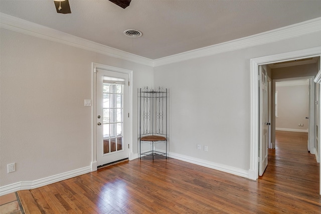 unfurnished room featuring ornamental molding, ceiling fan, and dark hardwood / wood-style flooring