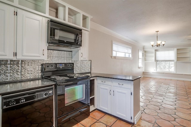 kitchen featuring black appliances, white cabinets, a chandelier, kitchen peninsula, and crown molding