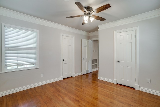 unfurnished bedroom with crown molding, ceiling fan, and light hardwood / wood-style flooring