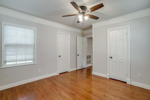 2309 Honeysuckle Ave, Fort Worth, TX 76111 - unfurnished bedroom featuring light wood finished floors, baseboards, ornamental molding, and ceiling fan