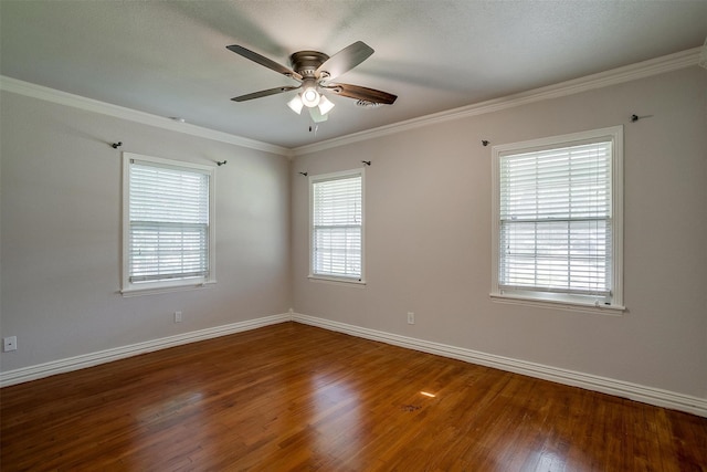 spare room with hardwood / wood-style flooring, crown molding, and ceiling fan