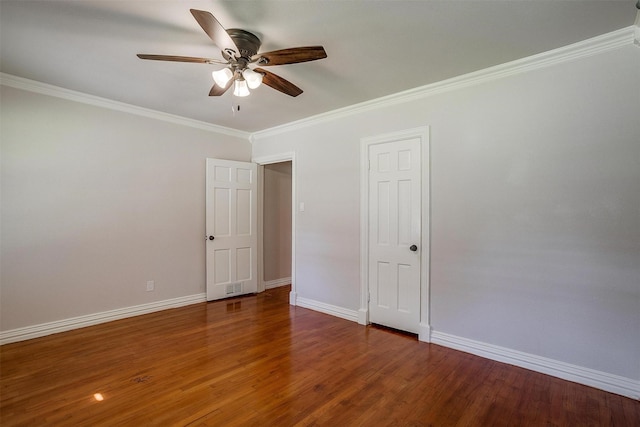 unfurnished room featuring crown molding, ceiling fan, and dark hardwood / wood-style floors