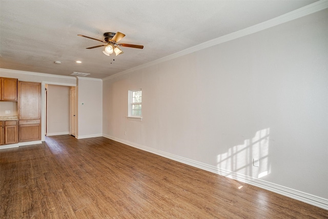 unfurnished room featuring ceiling fan, ornamental molding, and hardwood / wood-style floors