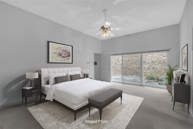 carpeted bedroom featuring access to exterior and ceiling fan