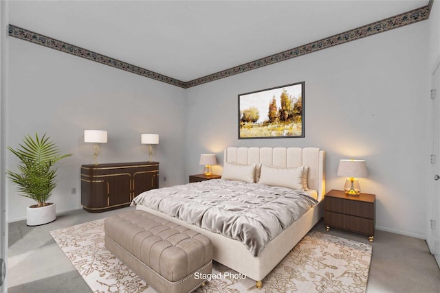 carpeted bedroom with baseboards