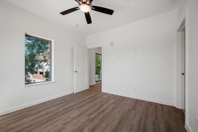 unfurnished bedroom featuring hardwood / wood-style flooring and ceiling fan