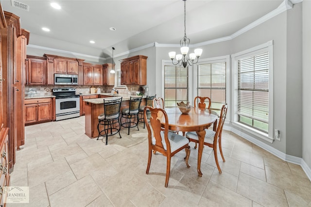 tiled dining area featuring a chandelier, sink, and ornamental molding