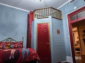 bedroom featuring crown molding