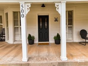 entrance to property with a porch