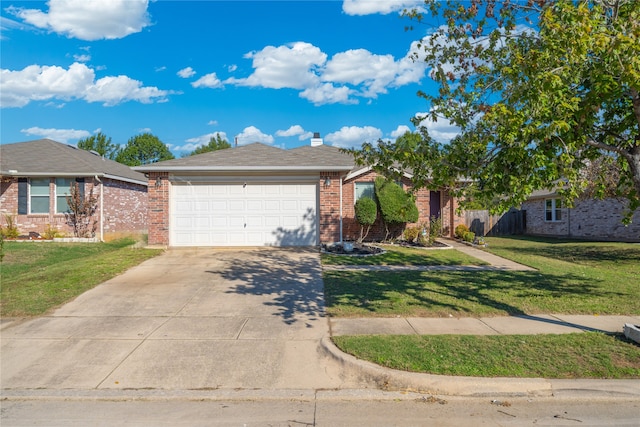 view of front of home with a front lawn and a garage