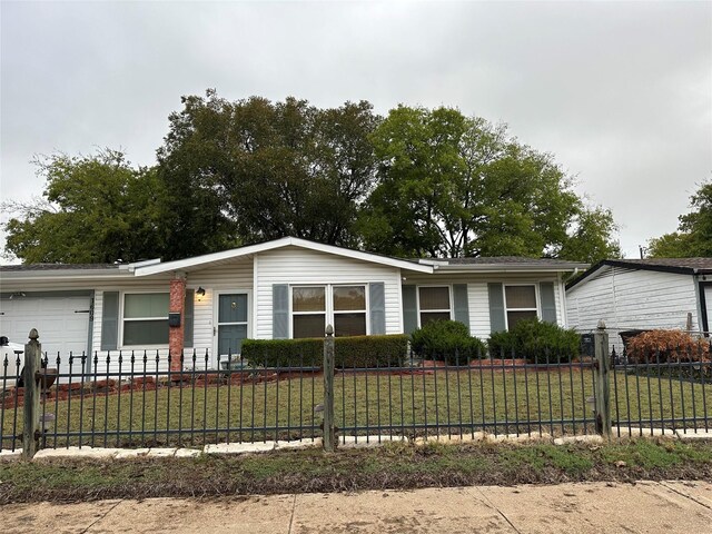 single story home with a garage and a front yard