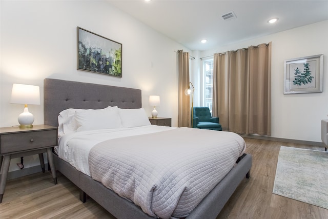 bedroom with light hardwood / wood-style floors