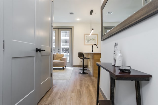 hallway featuring light hardwood / wood-style flooring