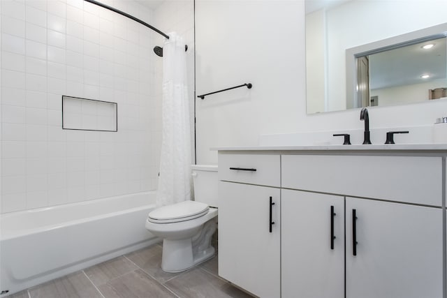 full bathroom featuring vanity, toilet, and shower / tub combo