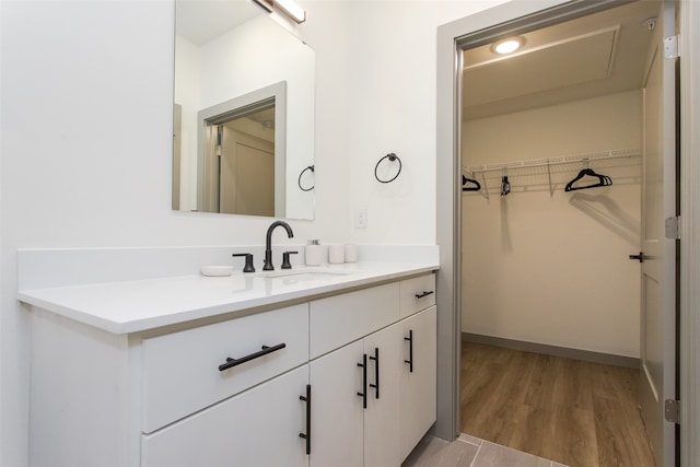 bathroom featuring vanity and hardwood / wood-style floors