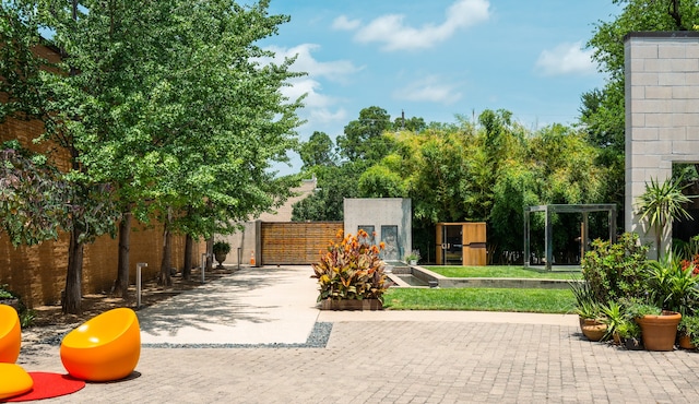 view of patio with exterior fireplace