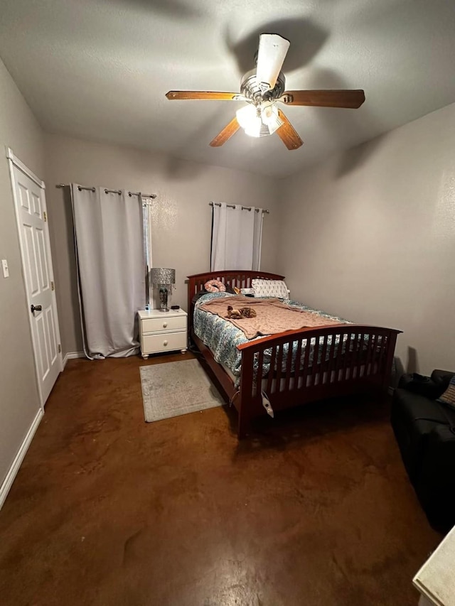 bedroom featuring baseboards and a ceiling fan