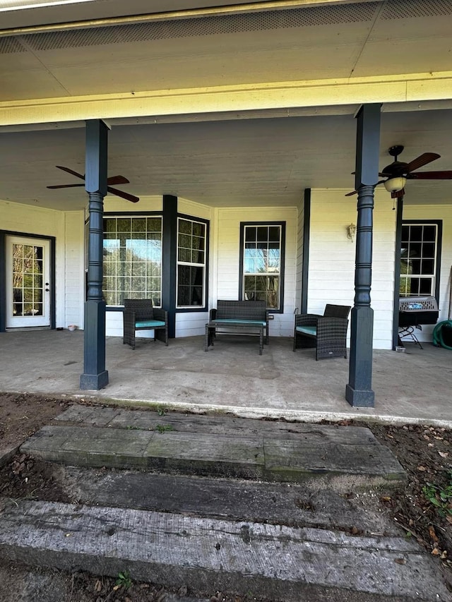 view of patio / terrace with an outdoor living space and a ceiling fan