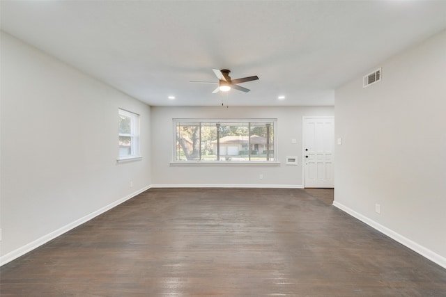 empty room featuring dark hardwood / wood-style floors and ceiling fan