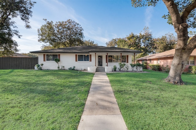 ranch-style house featuring a front lawn