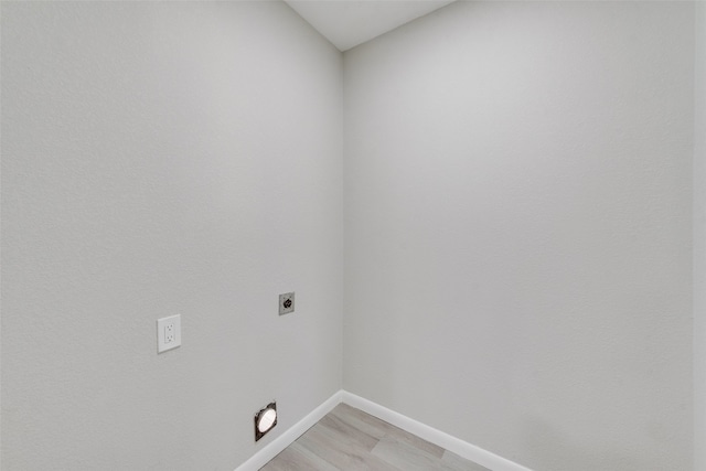 laundry room featuring light hardwood / wood-style floors and hookup for an electric dryer