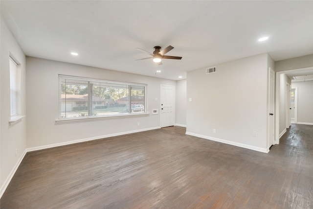 empty room featuring dark hardwood / wood-style flooring and ceiling fan