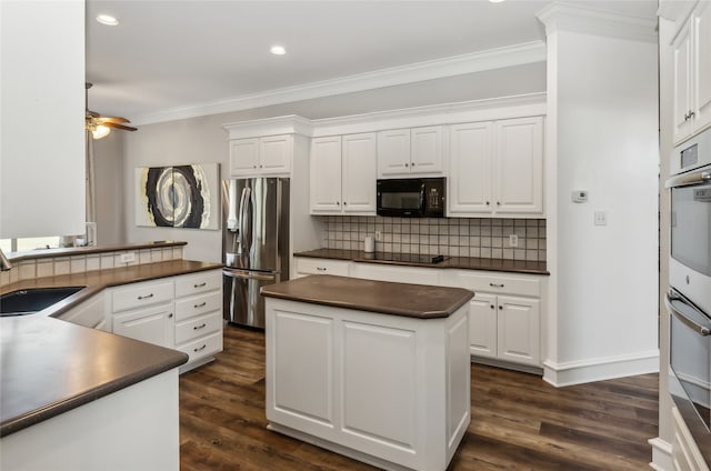 kitchen featuring white cabinets, black appliances, sink, and dark wood-type flooring