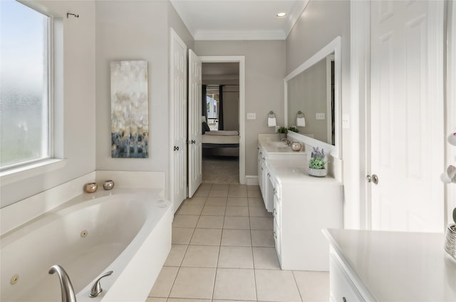 bathroom with ornamental molding, a washtub, vanity, and a healthy amount of sunlight