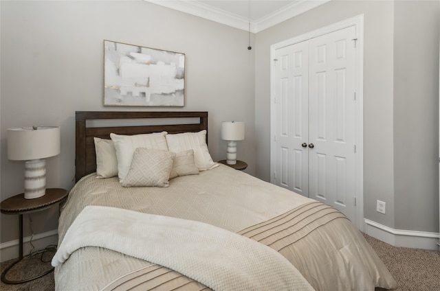 carpeted bedroom featuring a closet and crown molding