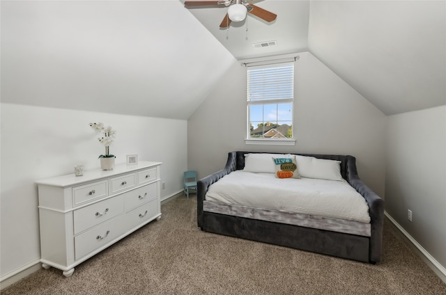 carpeted bedroom with vaulted ceiling and ceiling fan