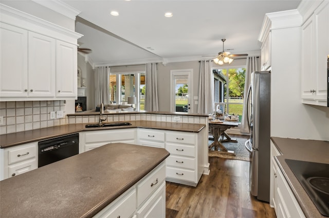 kitchen featuring white cabinets, dark hardwood / wood-style flooring, black appliances, and a healthy amount of sunlight