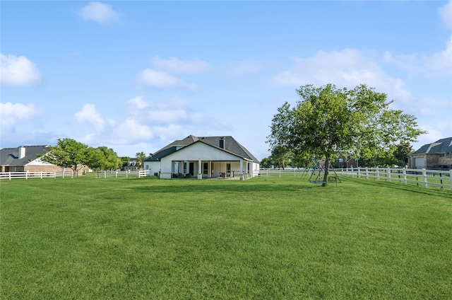 view of yard with a rural view