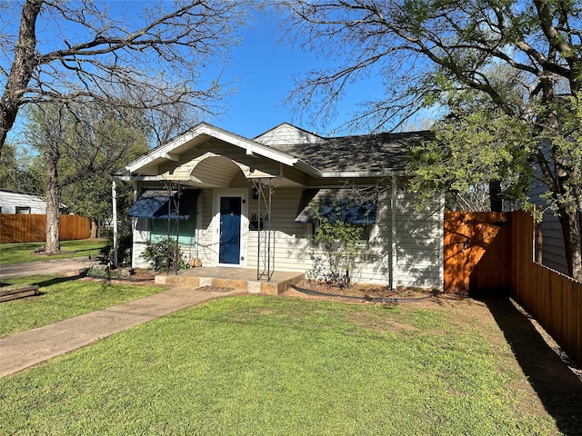 bungalow-style home featuring a front yard