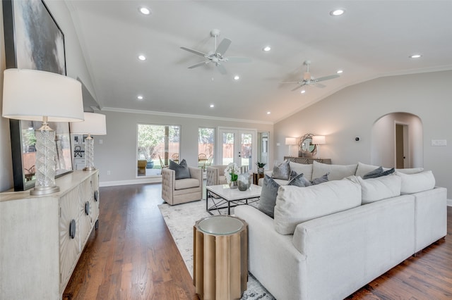 living room featuring ceiling fan, lofted ceiling, dark wood-type flooring, and ornamental molding