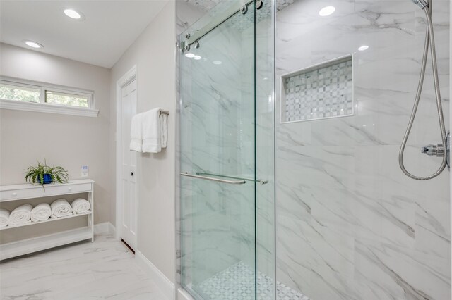 bathroom with toilet, an enclosed shower, and vanity